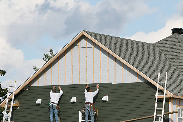 Professional Siding technician working in Dola, OH